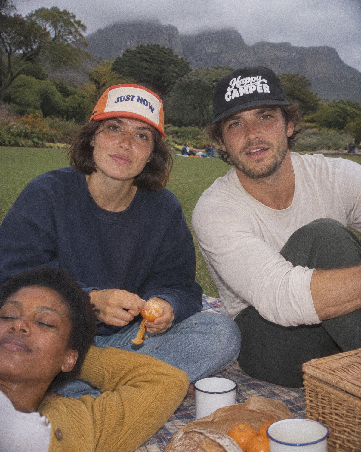 Picnic at Kirstenbosch in orange Just Now and black Happy Camper caps