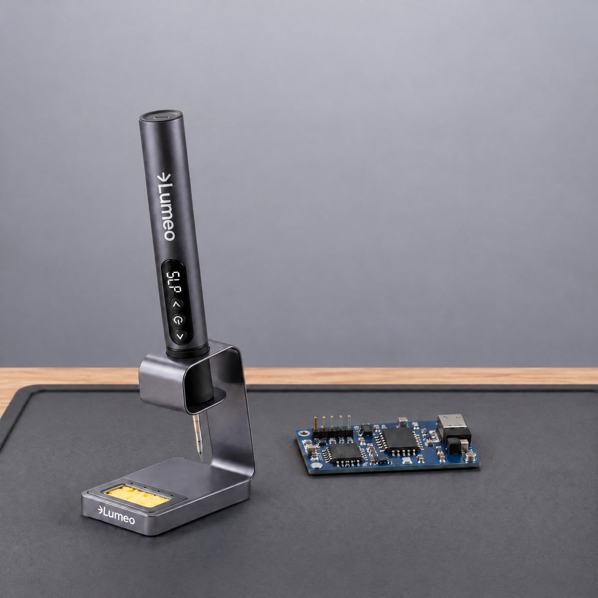 Lumeo QuickFix cordless soldering iron asleep in its stand showing SLP on the display