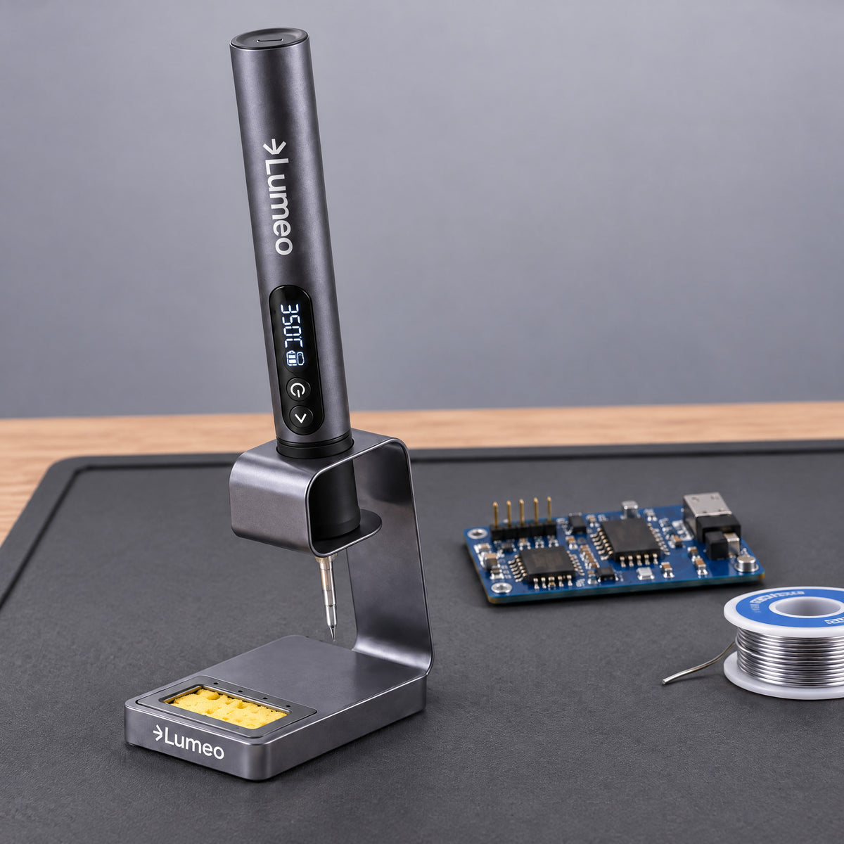 Lumeo QuickFix cordless soldering iron resting in its stand on a workbench