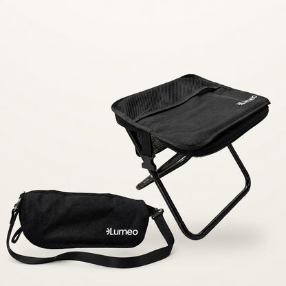 Lumeo Sling Stool open beside the folded bag with its shoulder strap