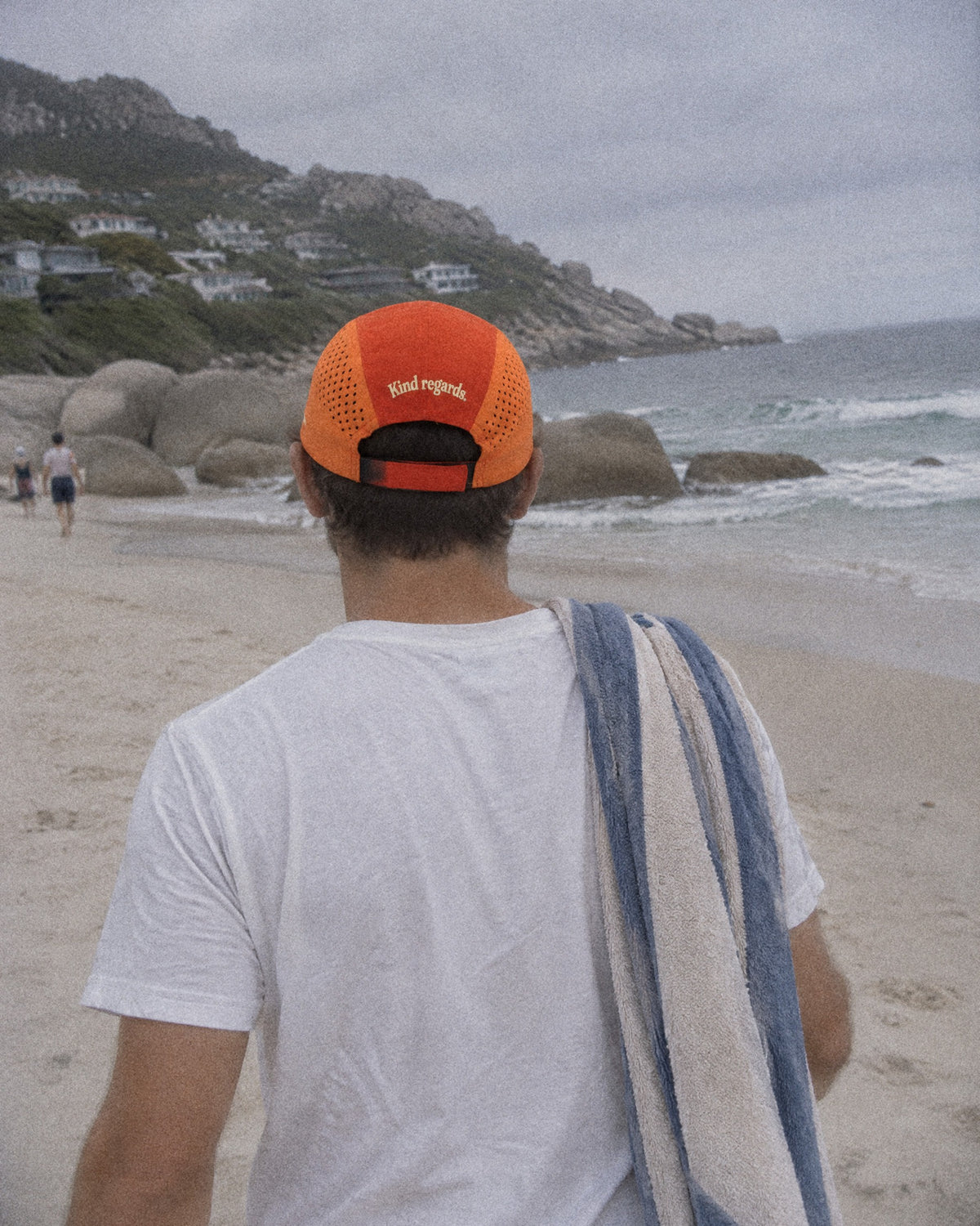 Back of the orange Out of Office cap on Llandudno beach