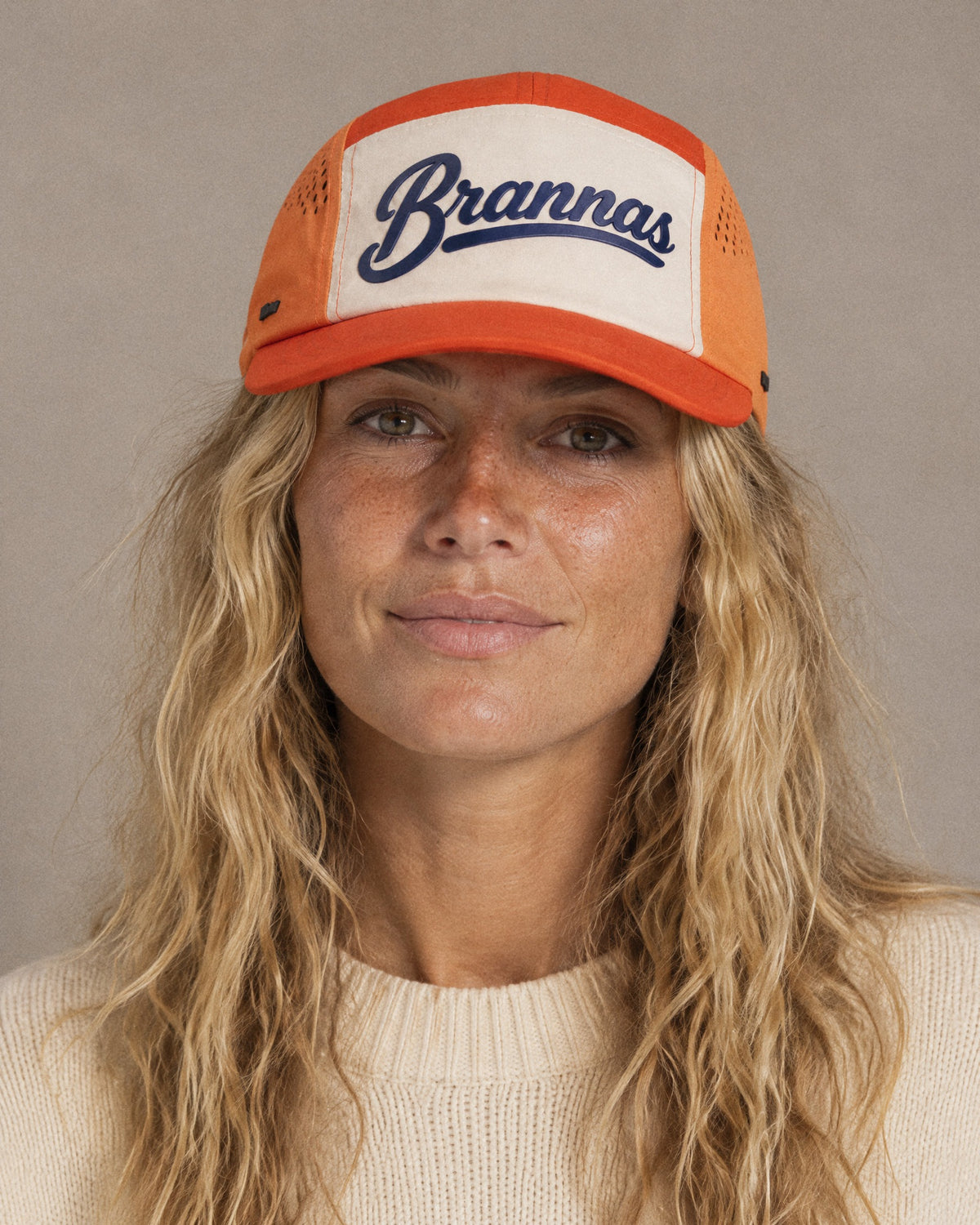 Studio portrait in the orange Brannas cap